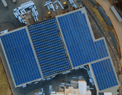 aerial-view-solar-panels-installed-roof-industrial-warehouse-area